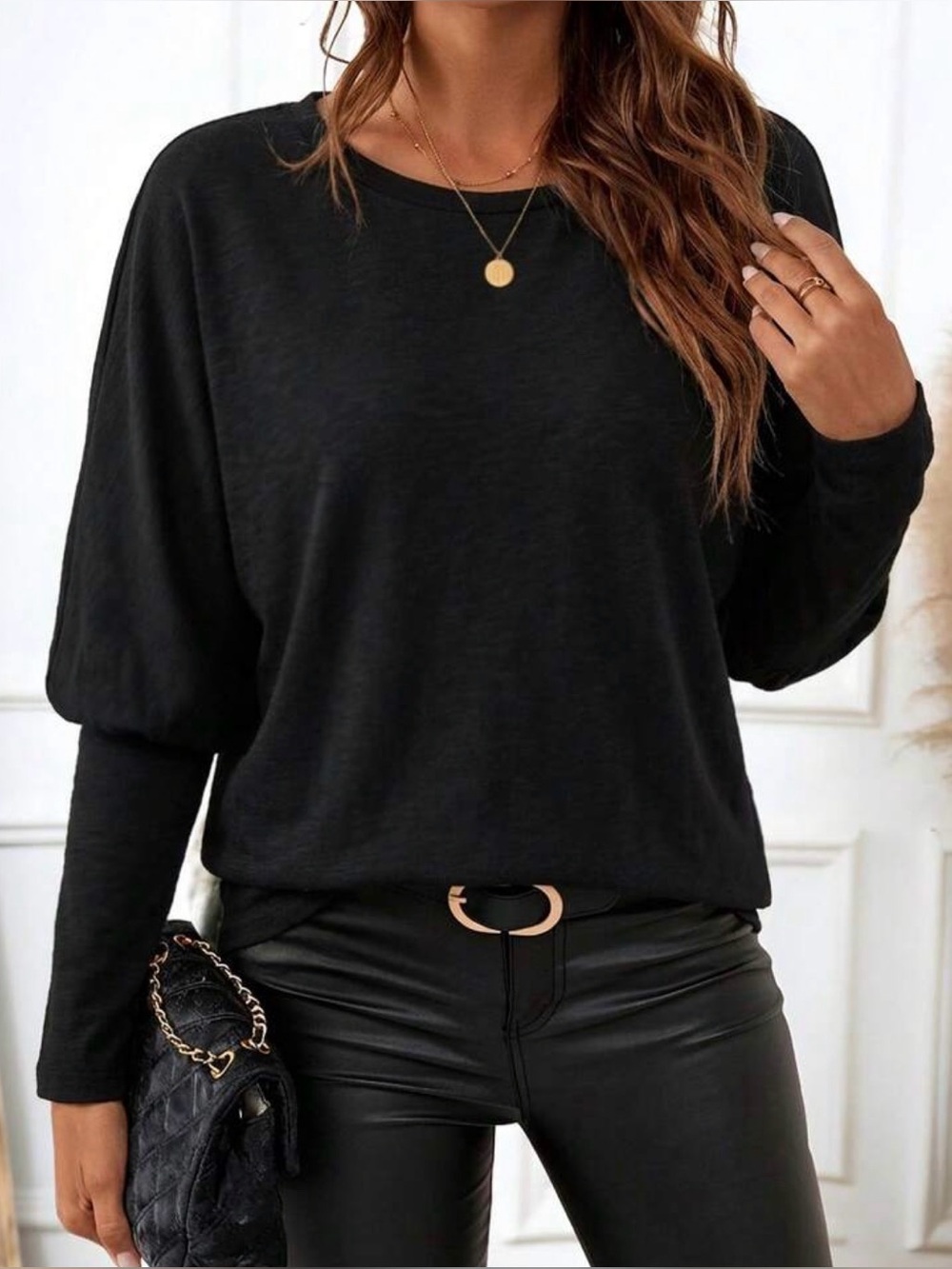 Women’s black long sleeved shirt. New, no tags.